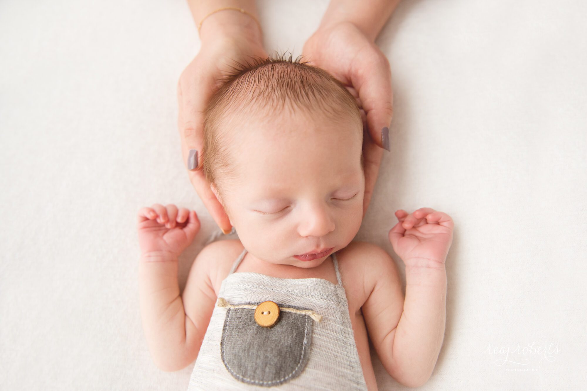 Newborn in mother's hands | Reaj Roberts Photography | Chandler area photographer