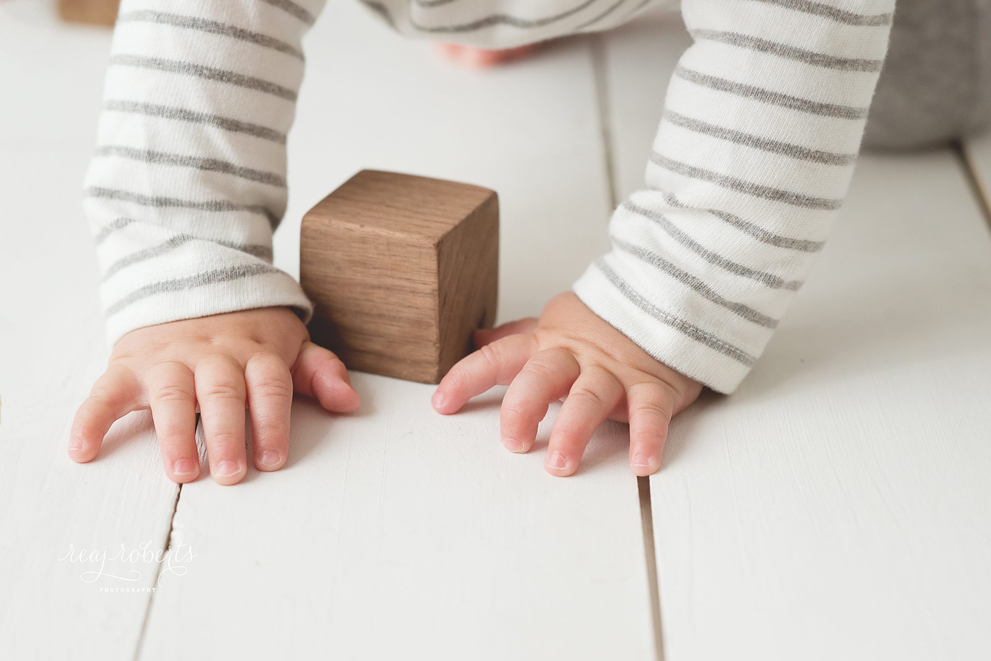 Baby hands with blocks