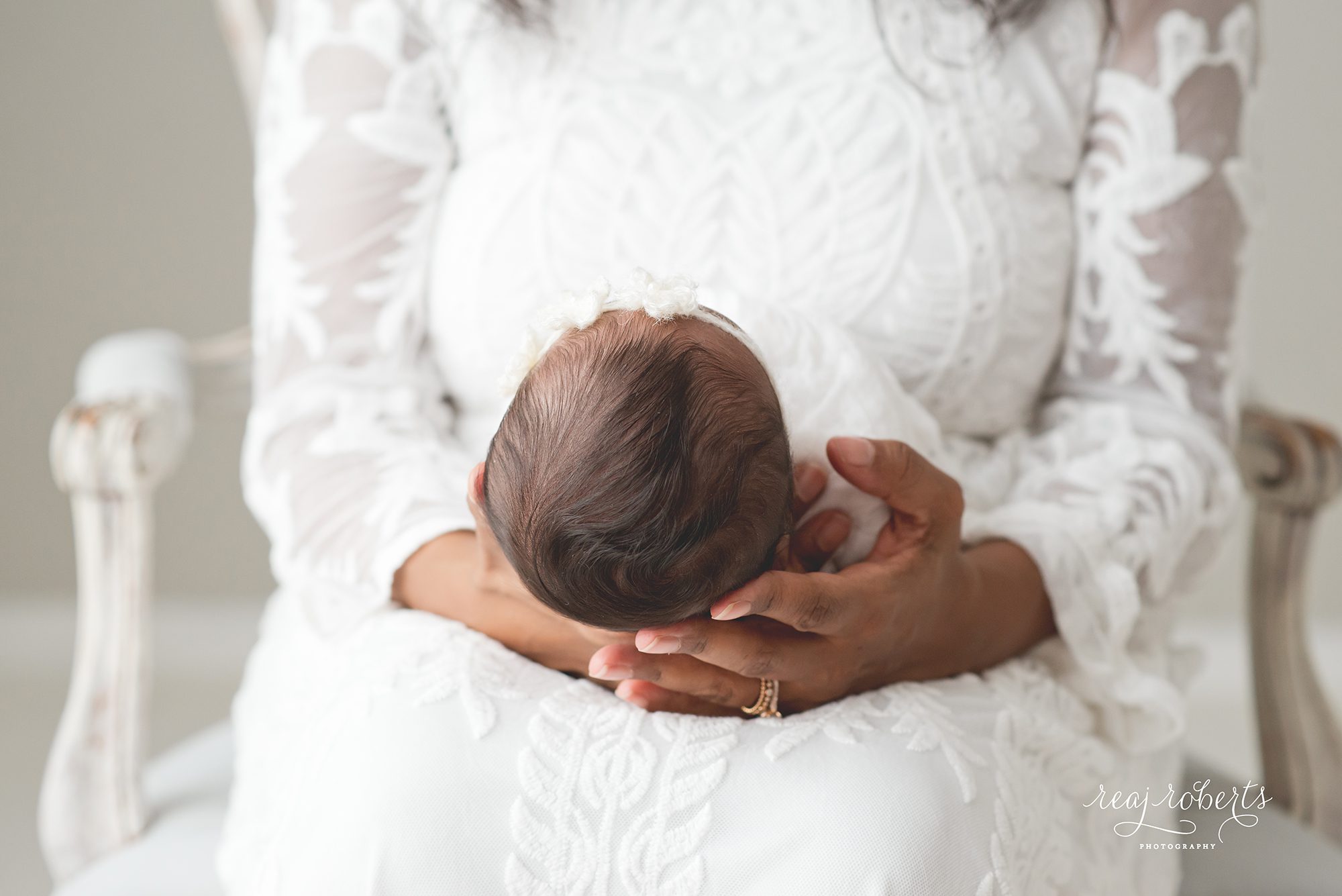 newborn baby with mother | Reaj Roberts Photography