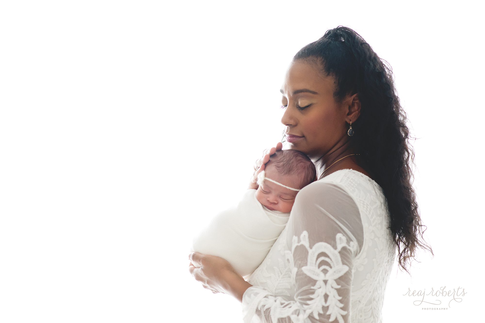 stunning black mother with newborn | | Reaj Roberts Photography
