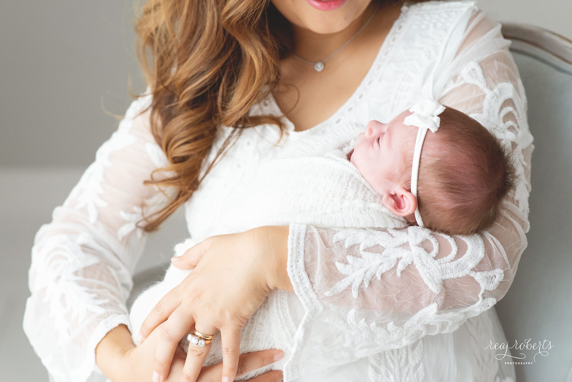 newborn swaddled held in mother's arms natural simple organic timeless newborn photos | Phoenix Newborn Photographer | Reaj Roberts Photography