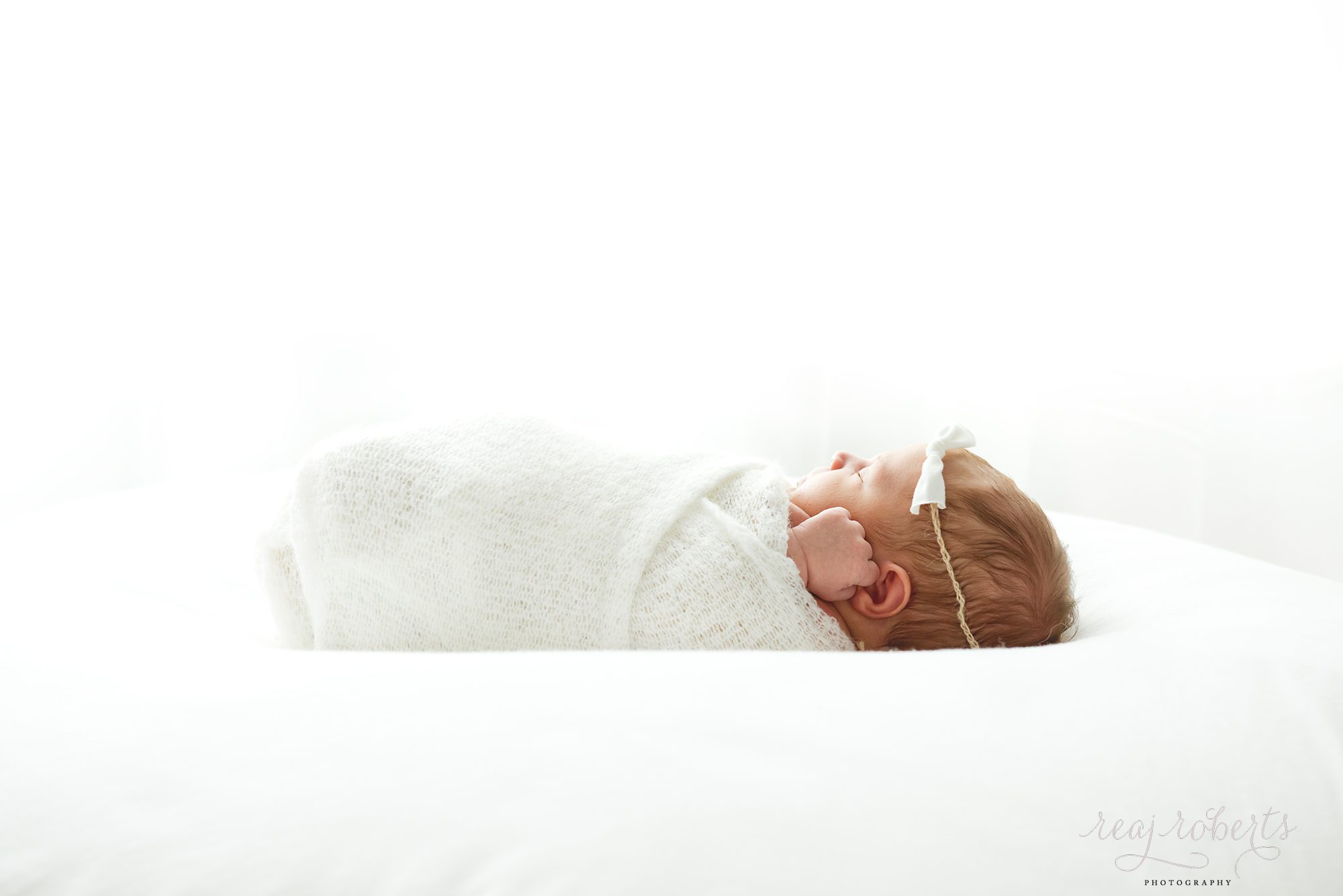 simple newborn baby girl photos swaddled | Reaj Roberts Photography