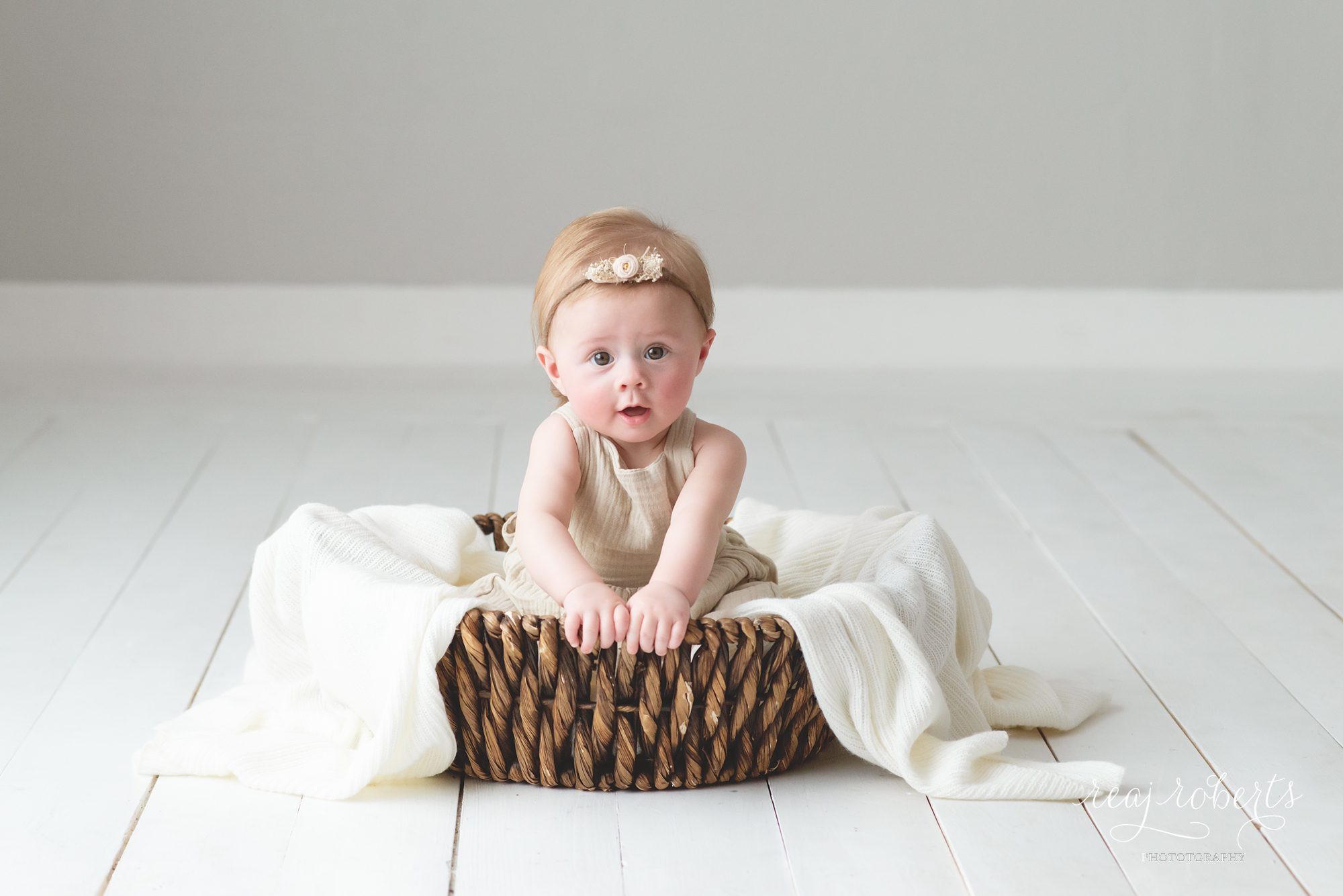 6 month baby picture ideas sitting in basket neutral colors | Reaj Roberts Photography