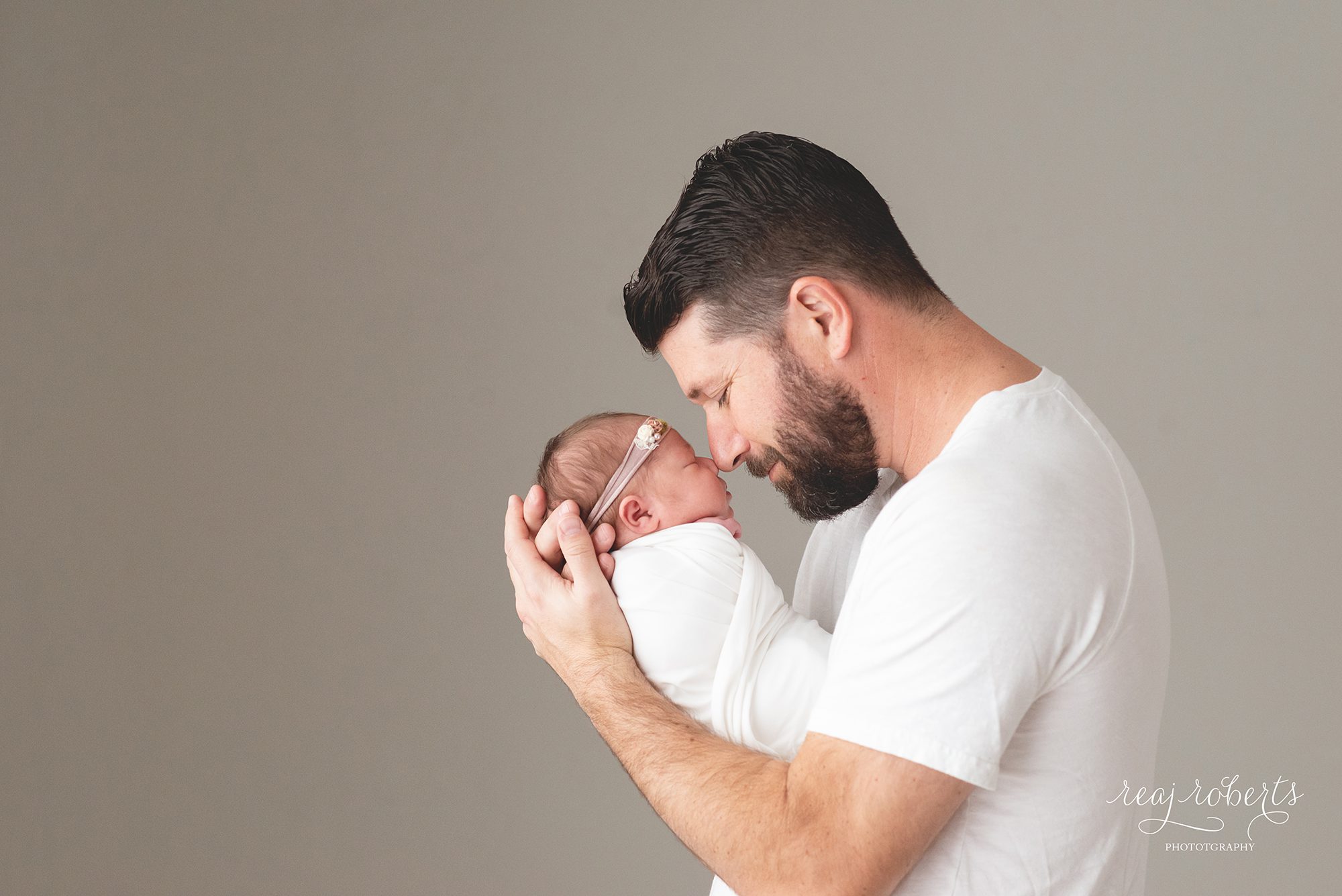 newborn baby girl snuggles with dad | Chandler, AZ | Reaj Roberts Photography