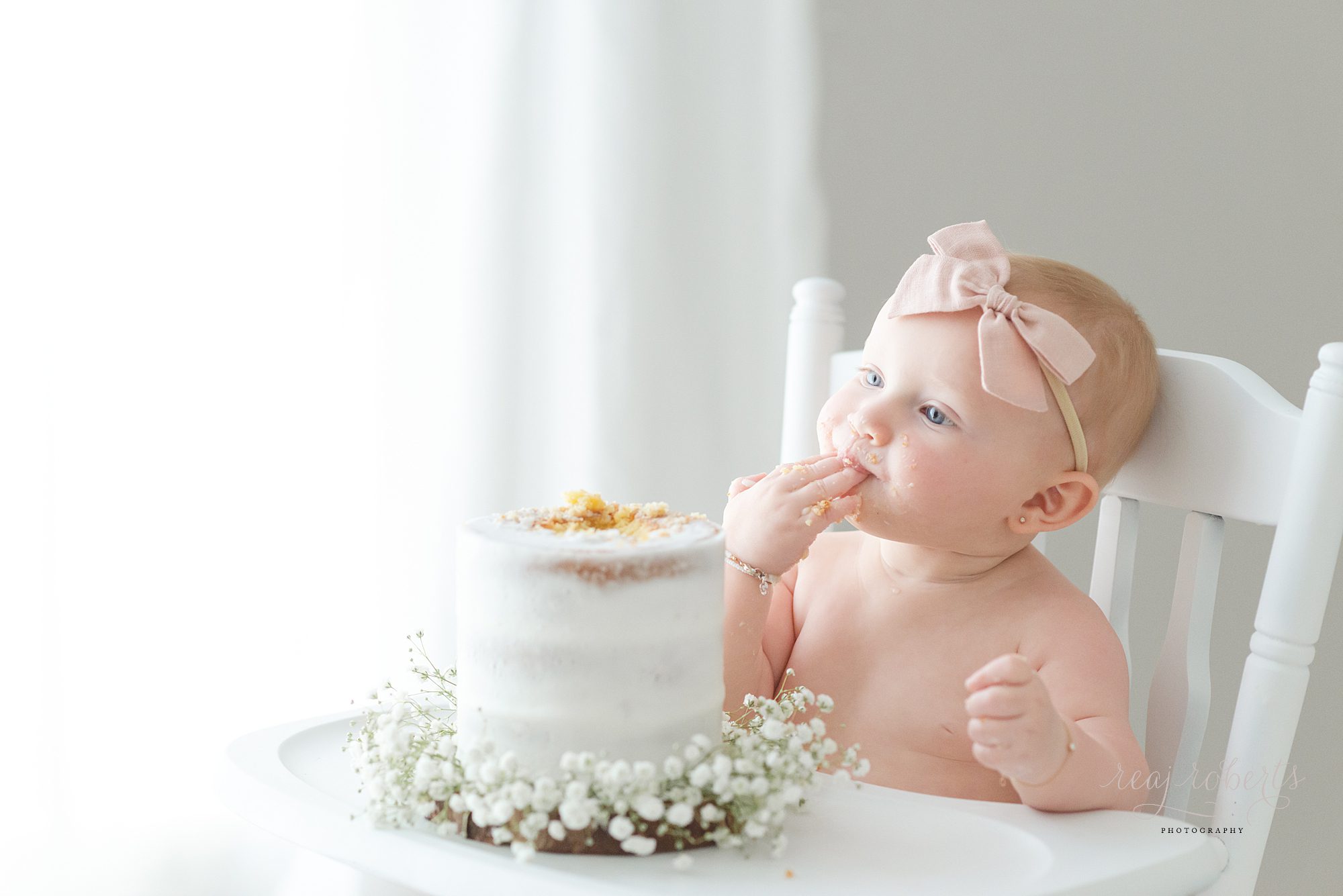 simple first birthday cake photos naked cake with baby's breath | Reaj Roberts Photography