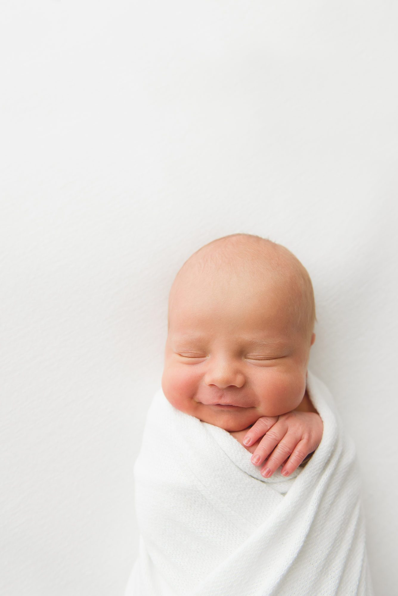 Minimalistic natural simple newborn photos baby boy smiling | Reaj Roberts Photography