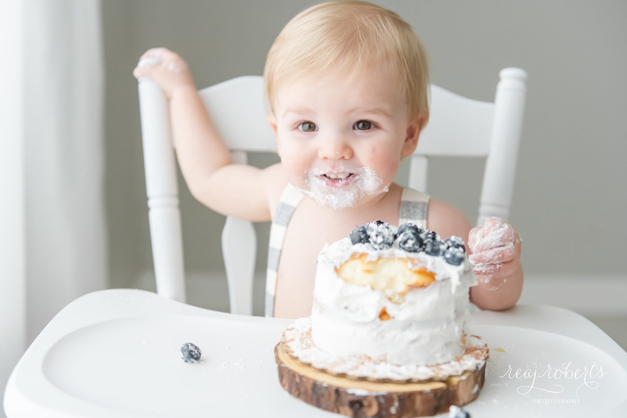 cake smash naked cake with blueberries baby in high chair | Reaj Roberts Photography