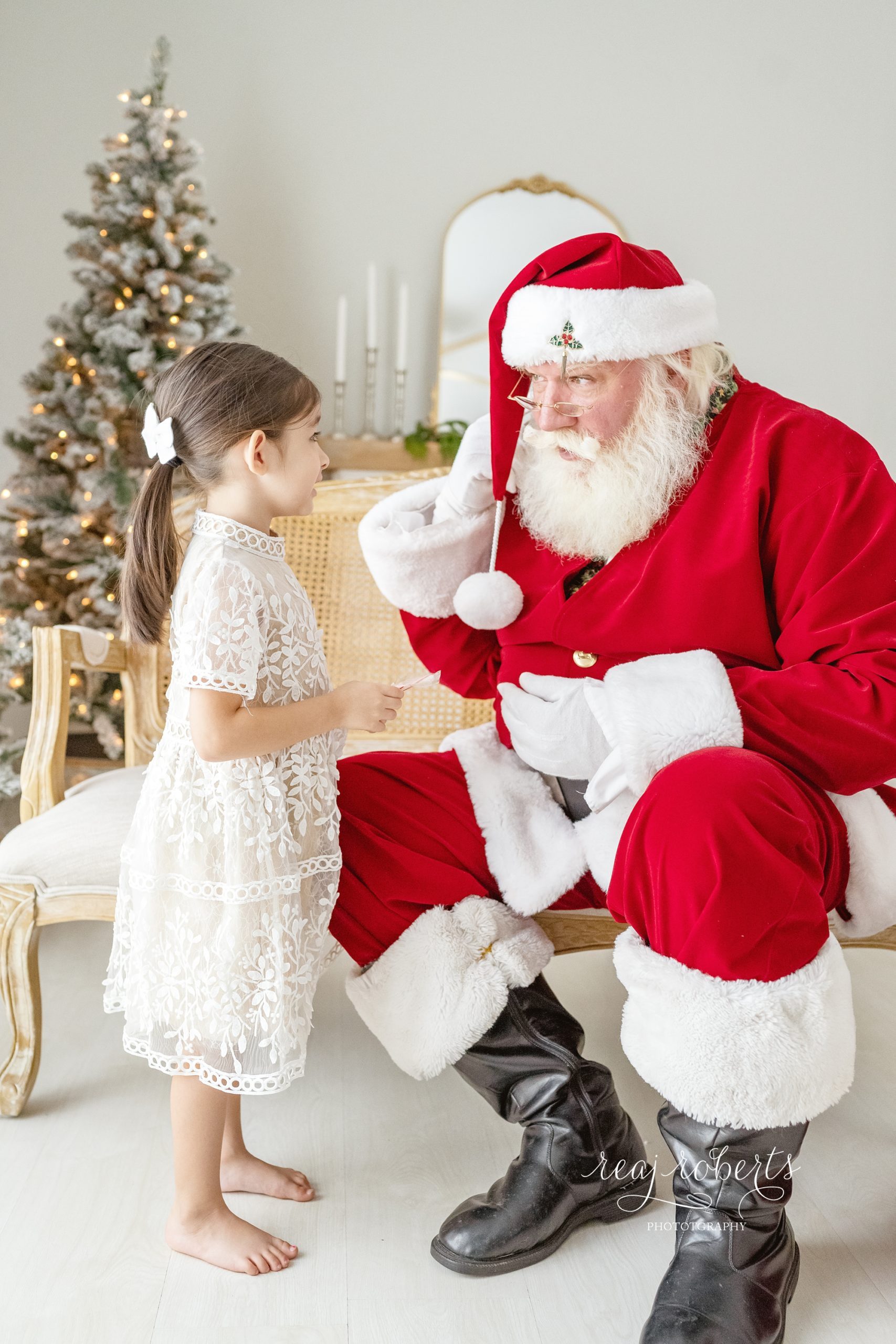 © Reaj Roberts Photography Scottsdale Arizona Photos with Santa Girl talking with Santa
